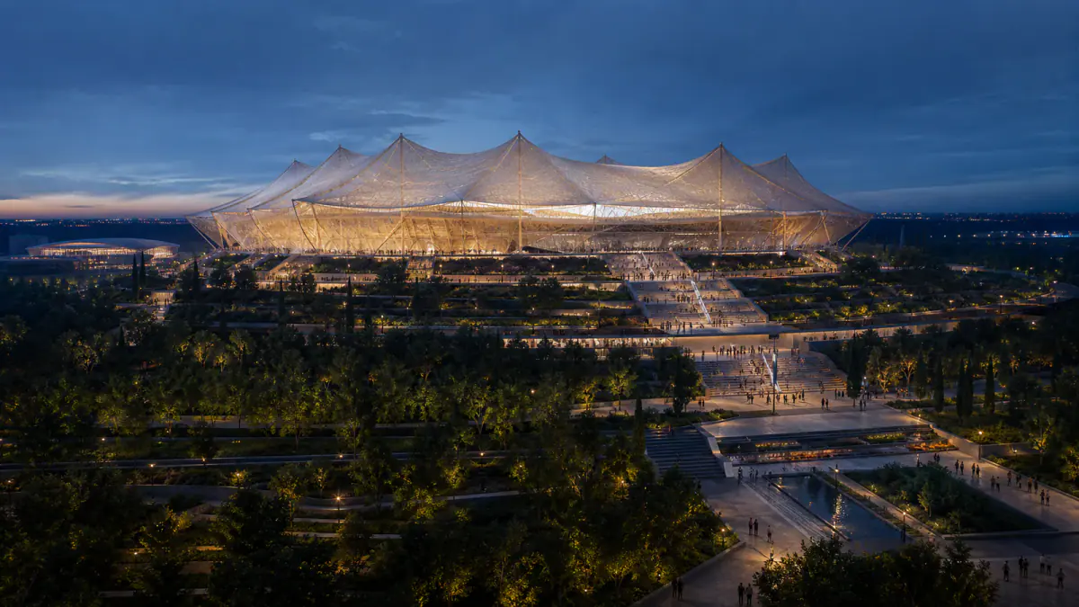 Editorial concept of a vast tent-inspired football stadium in a landscaped Moroccan campus