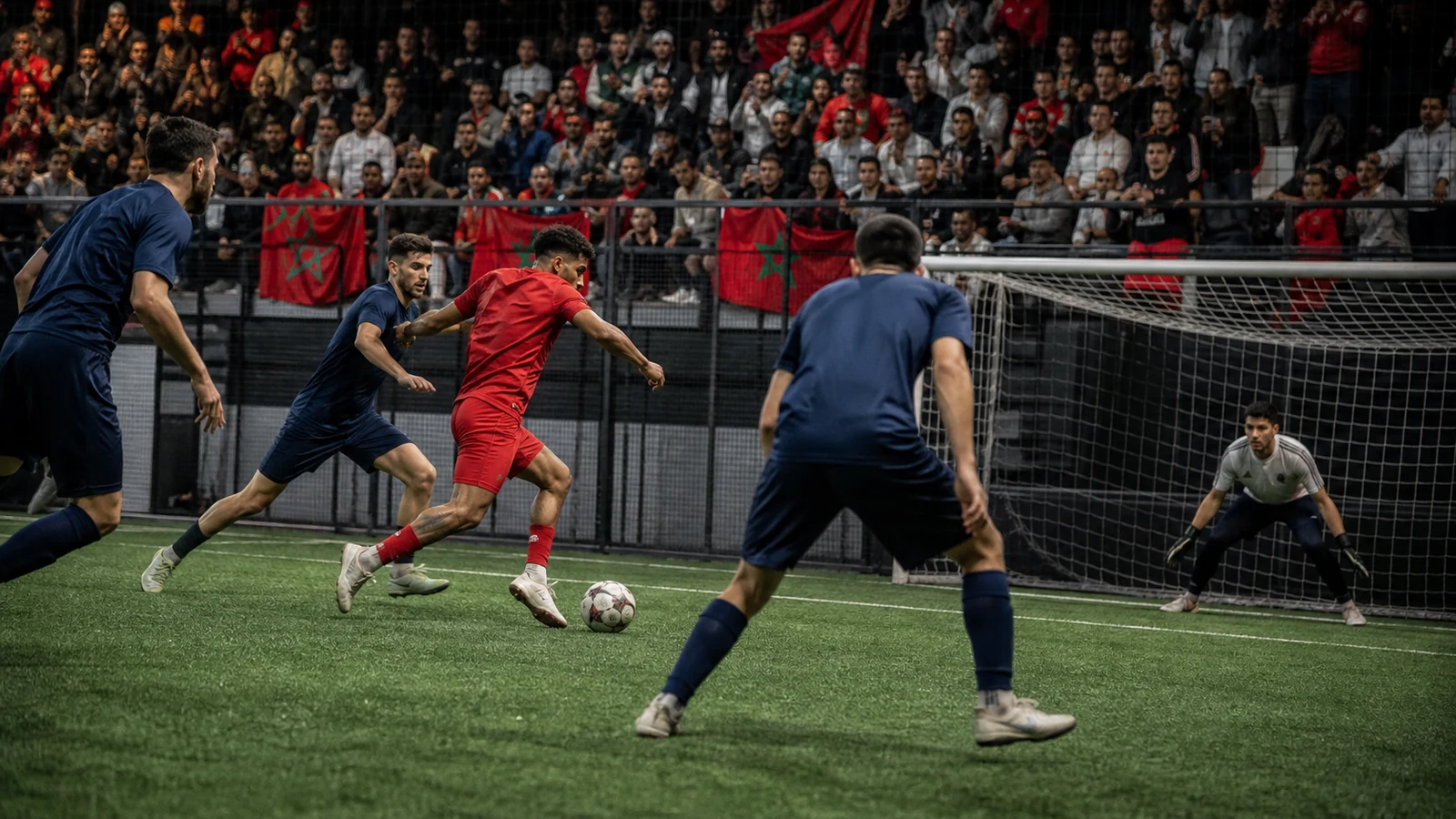 Moroccan supporters watching a tense small-sided football match near the goal