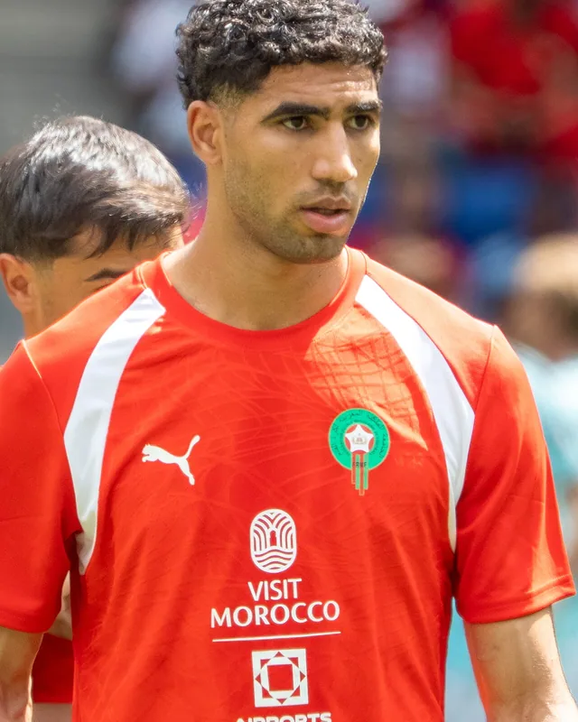 Achraf Hakimi in a red Morocco training shirt before a match