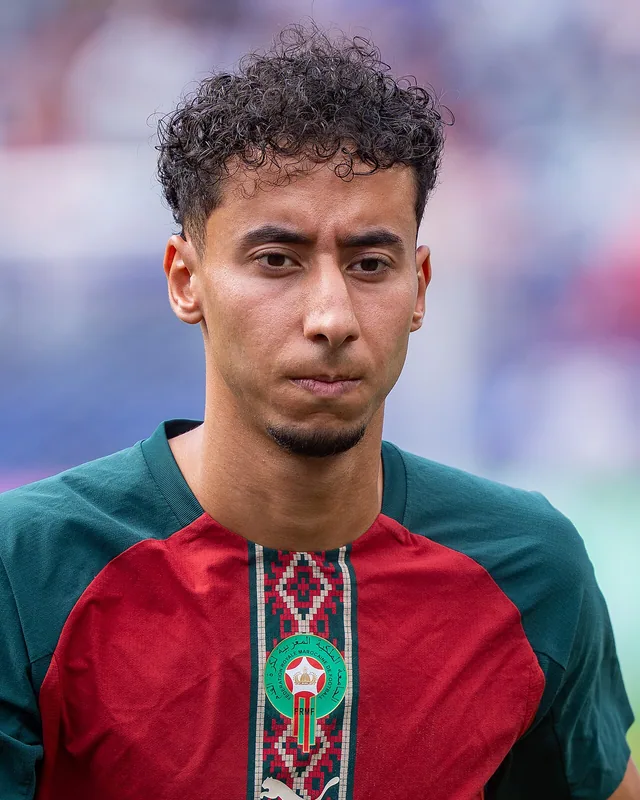 Anass Salah-Eddine wearing Morocco's red and green football shirt
