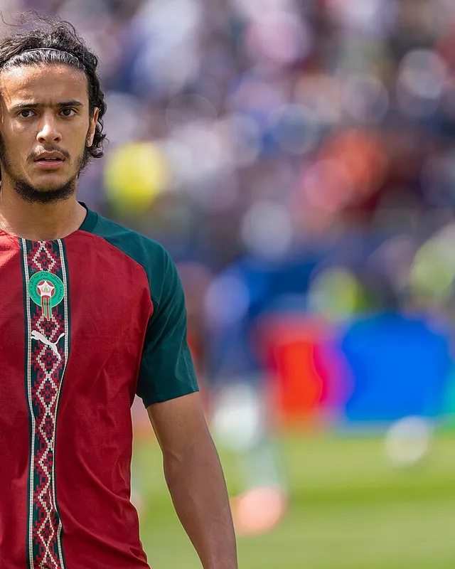 Ayyoub Bouaddi standing on the pitch in Morocco's national-team shirt