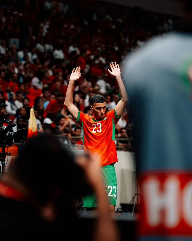 Bilal El Khannouss acknowledging supporters in Morocco's red shirt