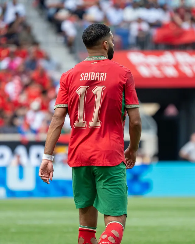 Ismael Saibari walking away from the camera in Morocco's number 11 shirt